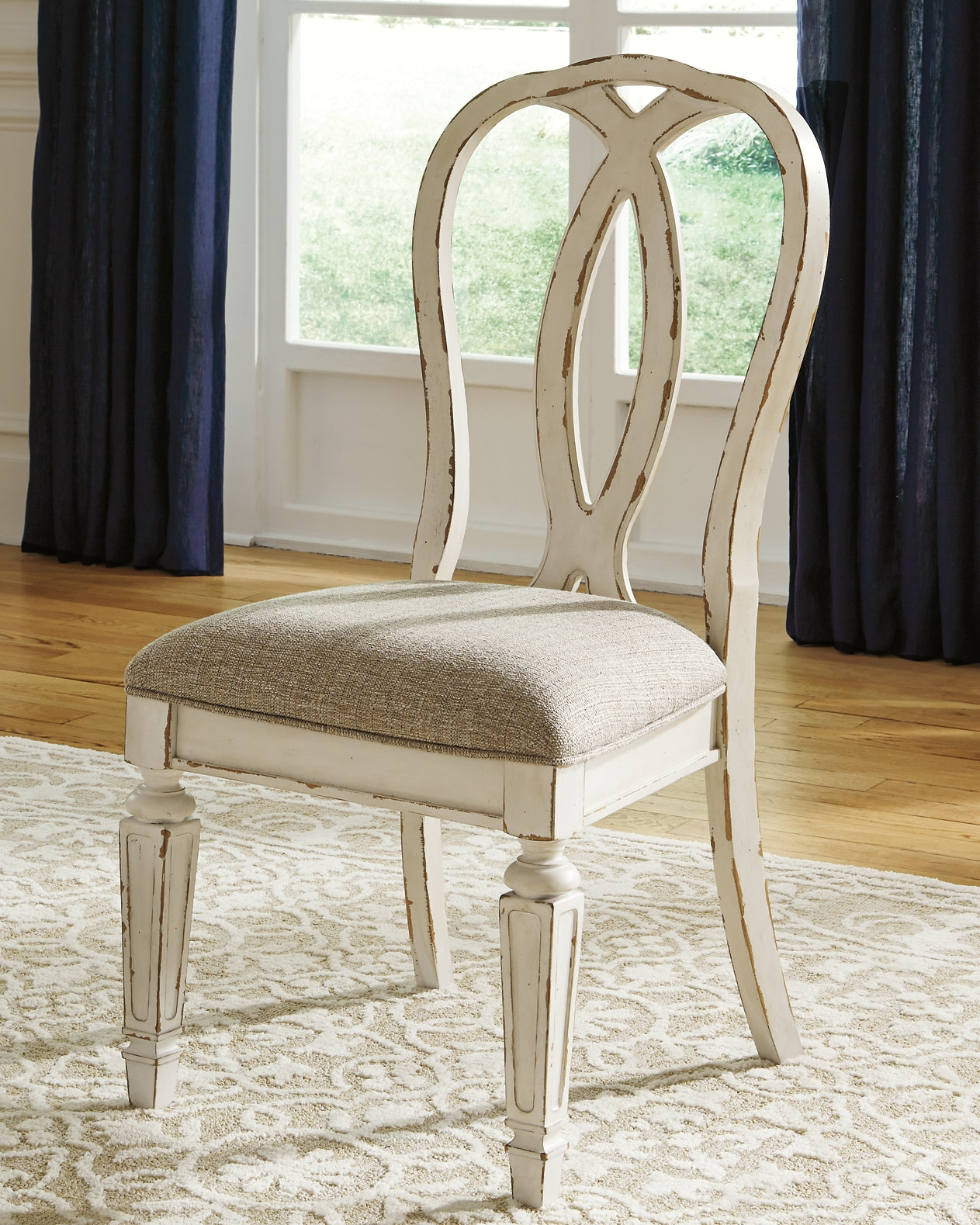 Realyn Dining Table and 8 Chairs at Walker Mattress and Furniture Locations in Cedar Park and Belton TX.