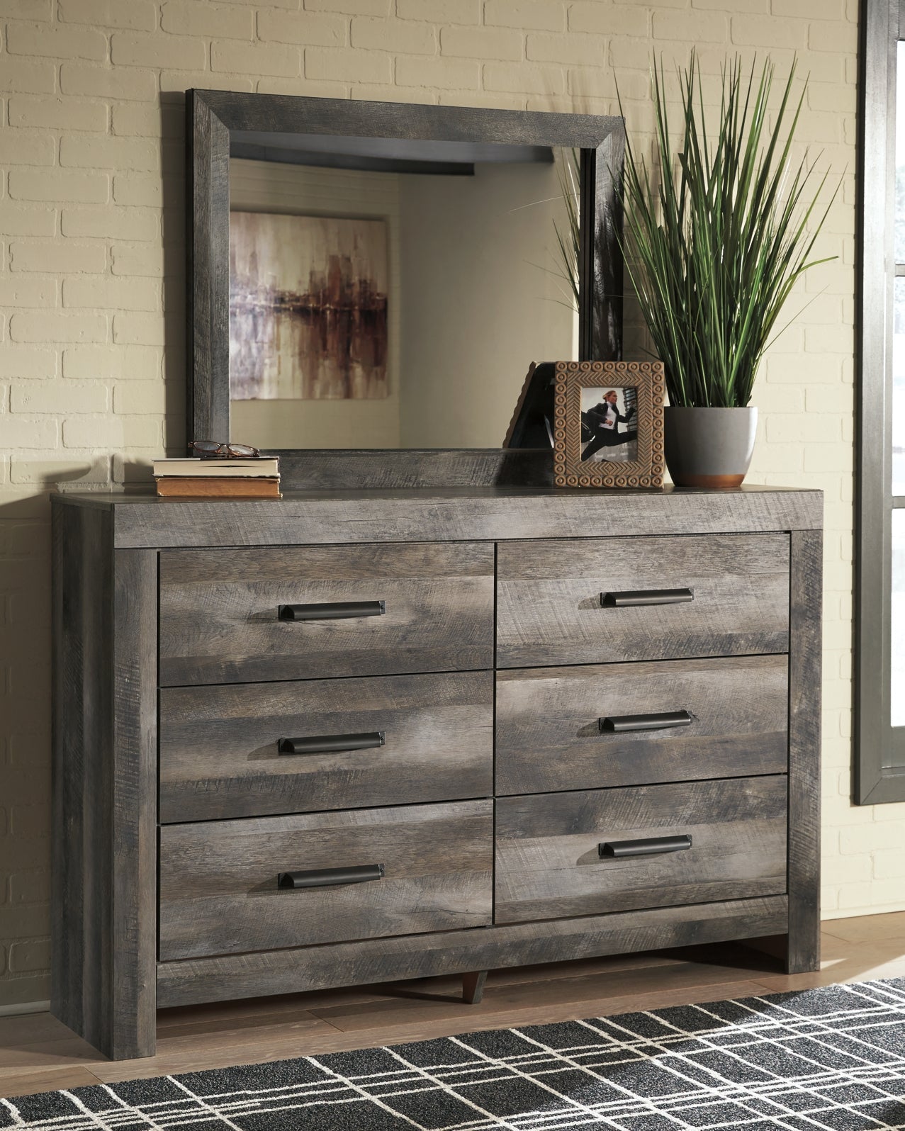 Wynnlow King Crossbuck Panel Bed with Mirrored Dresser, Chest and Nightstand at Walker Mattress and Furniture Locations in Cedar Park and Belton TX.
