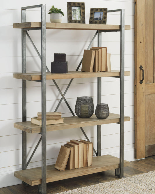 The Forestmin Bookcase, featuring a metal frame and wood shelves, stylishly displays books, framed photos, decor boxes, a plant, and textured vases—ideal for an urban eclectic look.