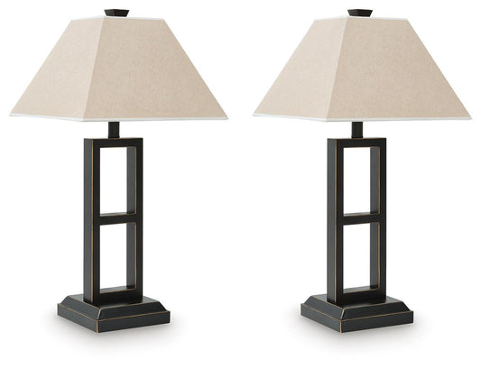 Two Deidra Metal Table Lamps (2/CN) with rustic metal bases and beige, linen-look pyramid-shaped shades are displayed side by side against a white background.
