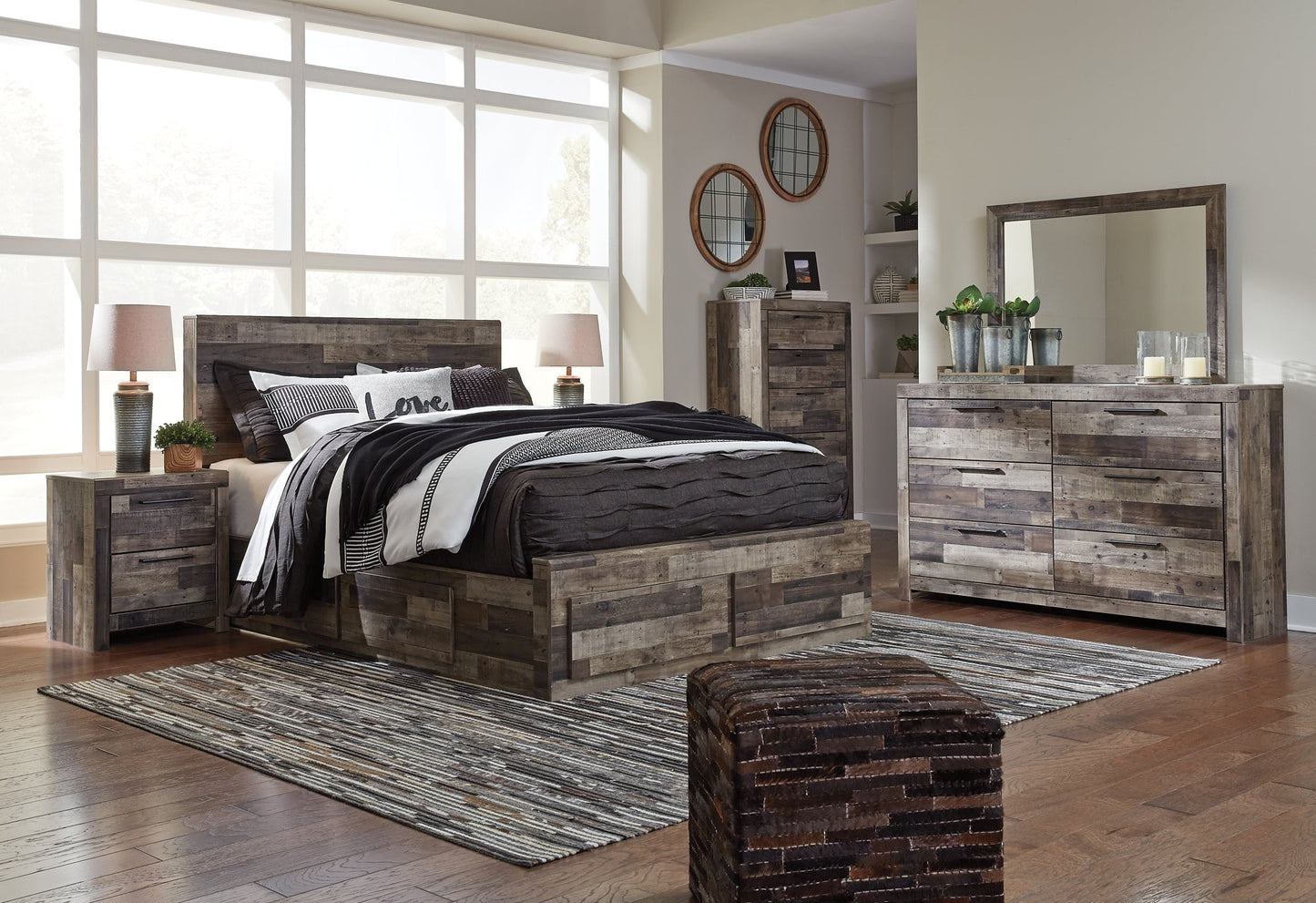 Derekson Queen Panel Bed with 4 Storage Drawers with Mirrored Dresser, Chest and Nightstand at Walker Mattress and Furniture Locations in Cedar Park and Belton TX.