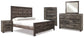 Wynnlow King Crossbuck Panel Bed with Mirrored Dresser, Chest and Nightstand at Walker Mattress and Furniture Locations in Cedar Park and Belton TX.