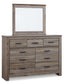 Zelen King Panel Bed with Mirrored Dresser and Chest at Walker Mattress and Furniture Locations in Cedar Park and Belton TX.