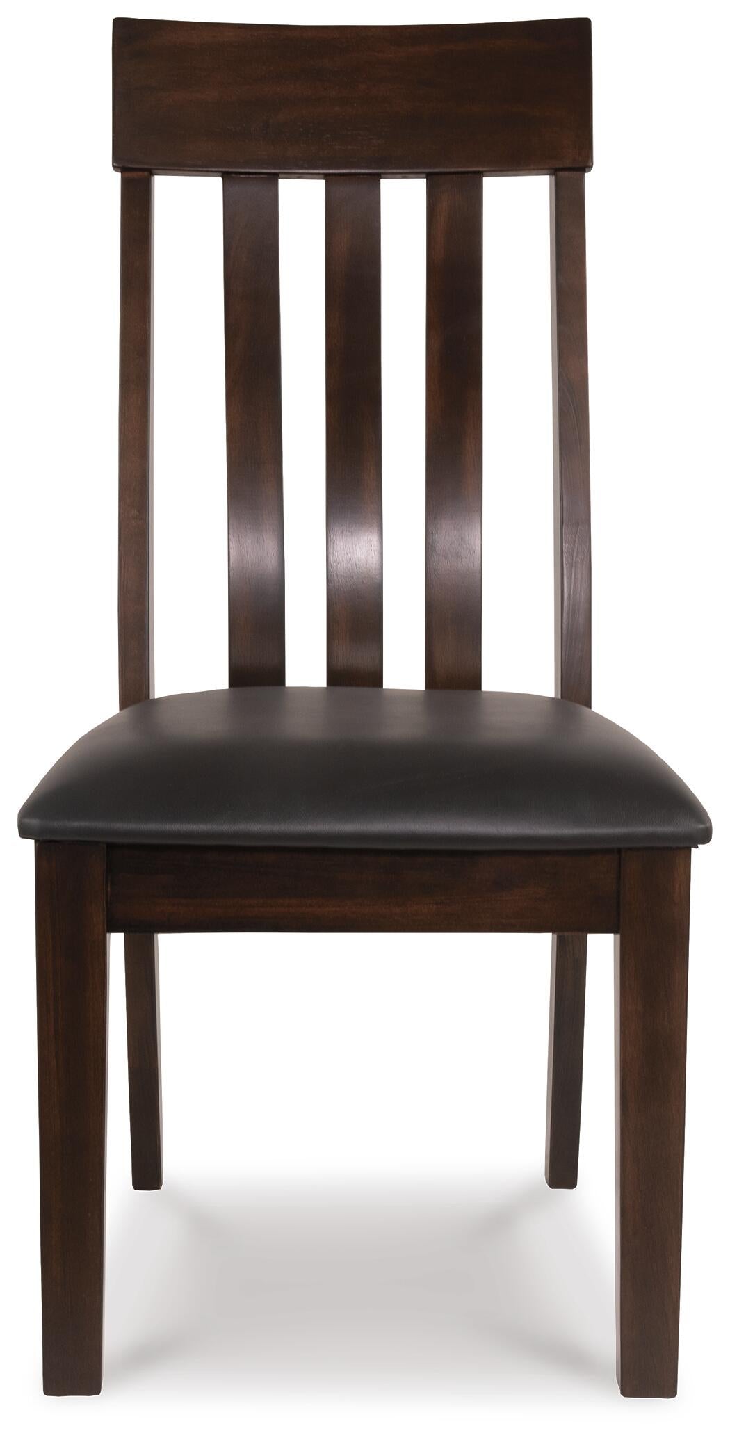 The Haddigan Dining UPH Side Chair (2/CN) features a dark wood finish, a slatted backrest, and a black faux leather upholstered seat, displayed facing forward.