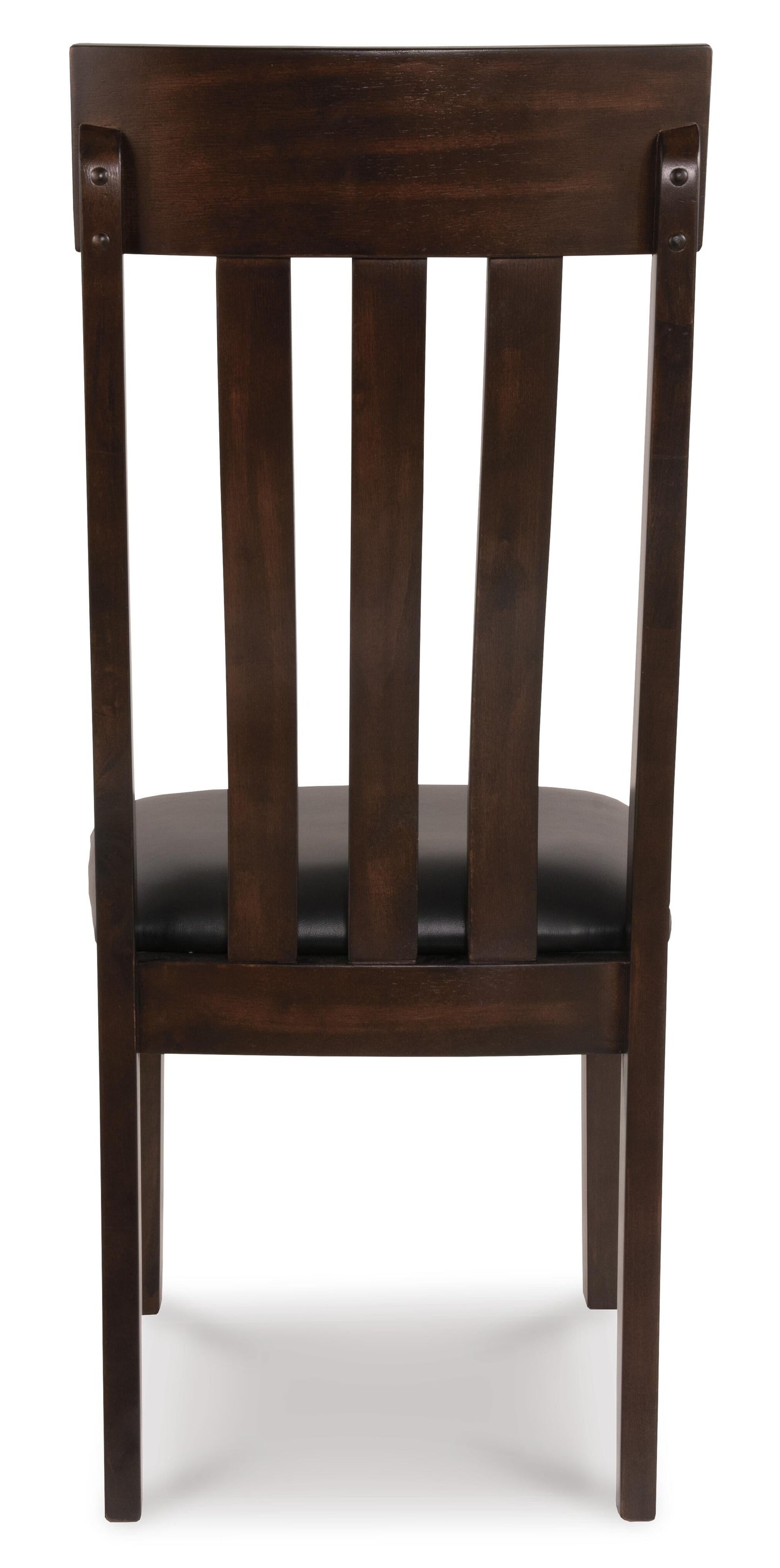 The Haddigan Dining Uph Side Chair (2/CN) features a dark brown finish, vertical slat backrest, and black faux leather upholstered seat, shown from the back.