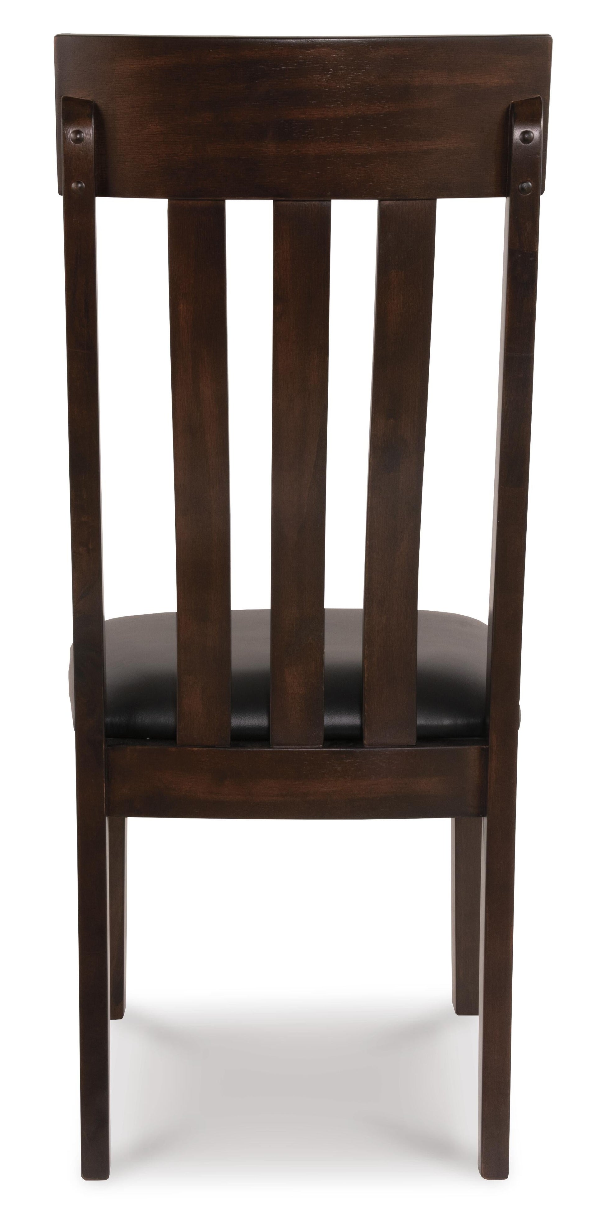 The Haddigan Dining Uph Side Chair (2/CN) features a dark brown finish, vertical slat backrest, and black faux leather upholstered seat, shown from the back.