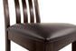 Close-up of the Haddigan Dining UPH Side Chair (2/CN) featuring a dark brown cushioned seat and vertical slat backrest, shown against a white background.