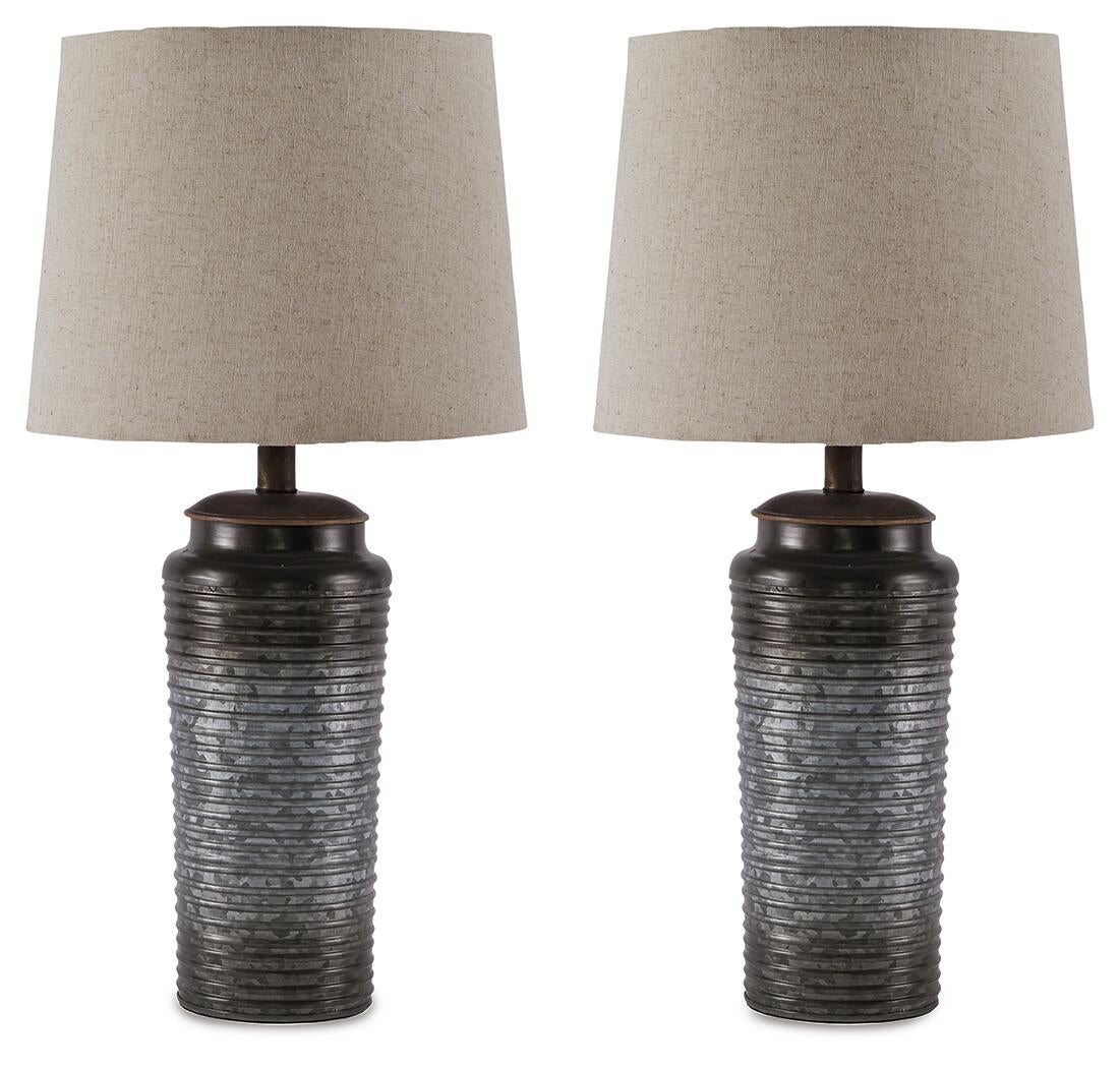 A pair of Norbert Metal Table Lamps featuring textured dark metal bases and light beige fabric lampshades, evoking modern sophistication, are displayed against a white background.