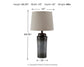 The Norbert Metal Table Lamp (2/CN) features a galvanized, textured base with a beige shade; measures 24.75"H x 13"W x 13"D and weighs 8 lbs.