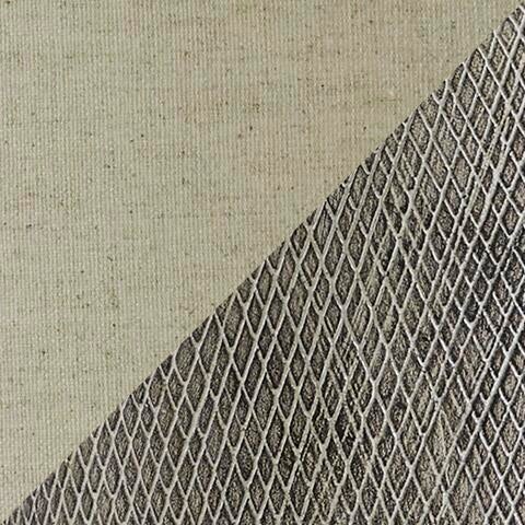 A diagonal line splits the image: smooth beige on the left, textured diamond-patterned metal on the right, echoing the striking contrast found near a Linus Ceramic Table Lamp with its distinctive ceramic base.