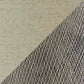 A diagonal line splits the image: smooth beige on the left, textured diamond-patterned metal on the right, echoing the striking contrast found near a Linus Ceramic Table Lamp with its distinctive ceramic base.