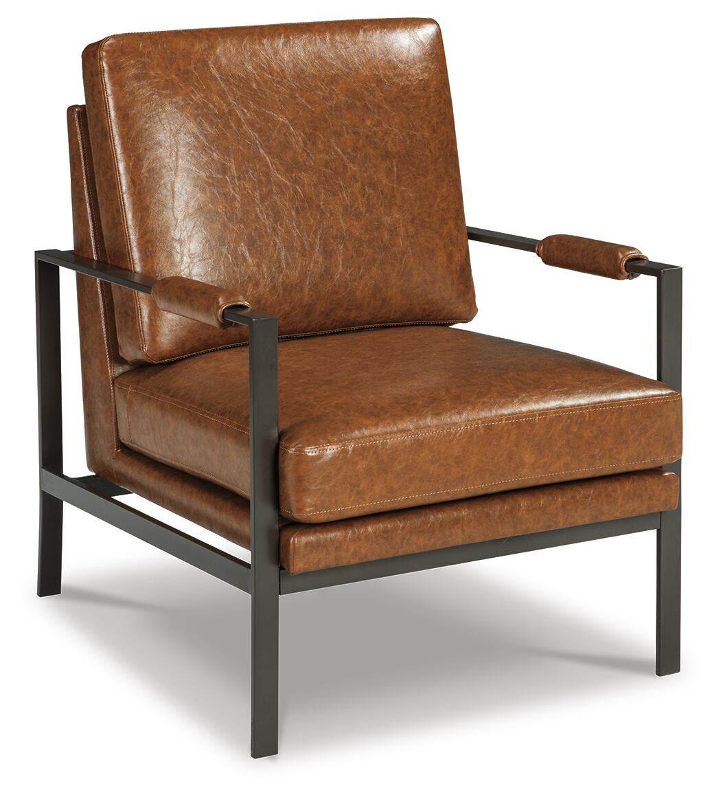 The Peacemaker Accent Chair features brown faux leather cushions, padded faux leather armrests, and a sleek black metal frame for a contemporary look.