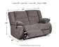 The Tulen Reclining Loveseat features gray chenille upholstery, dual-sided reclining (partially extended), and measures 40" H x 63" W x 40" D. Weight: 174 lbs.