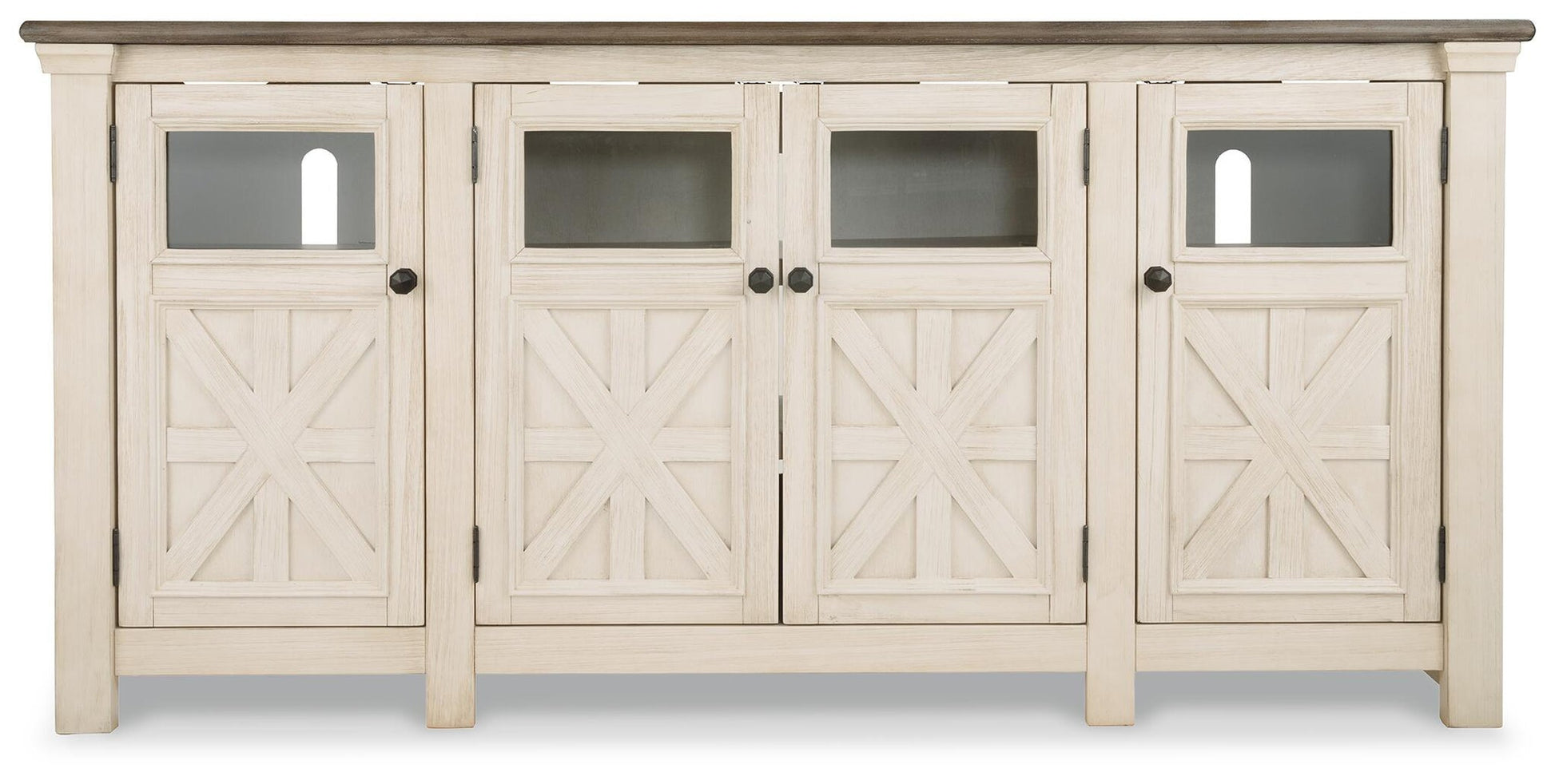 The Bolanburg Extra Large TV Stand is a white wooden sideboard with four doors featuring X-patterns and glass panels, dark handles, and a contrasting dark top for a stylish two-tone farmhouse look.