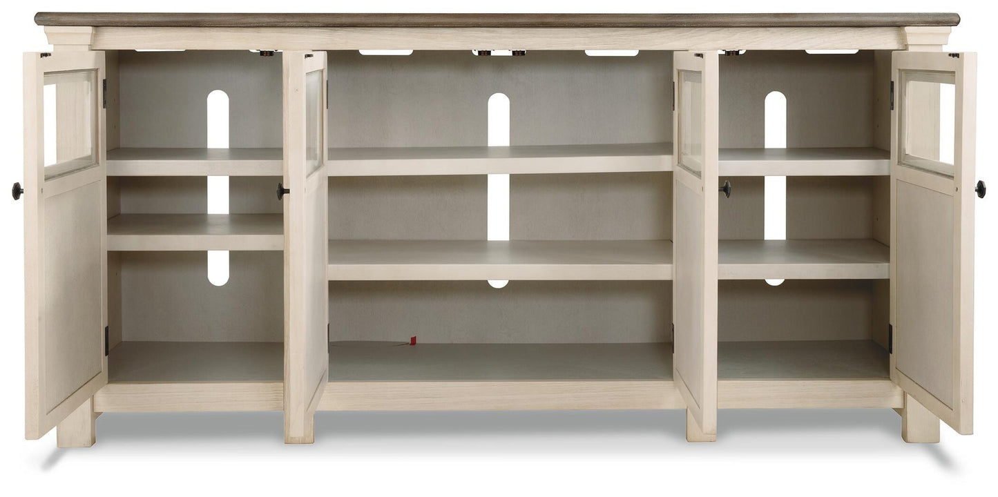 The Bolanburg Extra Large TV Stand features four open cabinet doors, three interior shelves, and back panel cable management—perfect for keeping your media essentials organized.