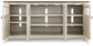The Bolanburg Extra Large TV Stand features four open cabinet doors, three interior shelves, and back panel cable management—perfect for keeping your media essentials organized.