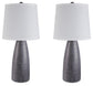 The Shavontae Poly Table Lamp set includes two identical contemporary lamps with dark textured bases and white drum-shaped shades, displayed side by side against a white background.