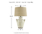 The Emelda Ceramic Table Lamp (1/CN) features a farmhouse style with two handles and a beige shade. Measures 27.5" high, 16" wide/deep, and weighs 9 lbs. Measurements shown with arrows.