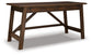 The Baldridge Home Office Large Leg Desk features two drawers, angled legs, a crossbar support, and a dark brown finish. Its simple, rustic design makes it perfect for any workspace.