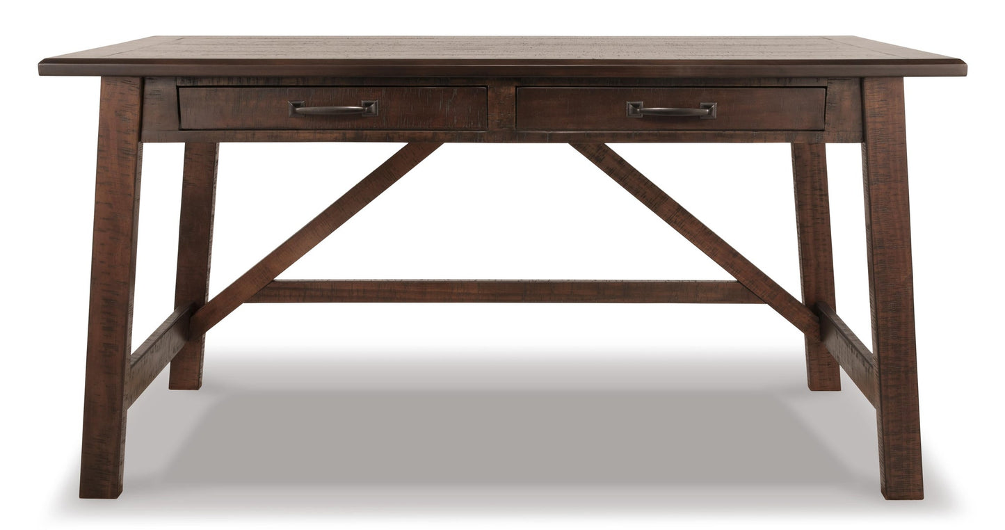 The Baldridge Home Office Large Leg Desk features a dark rustic finish, two drawers with metal handles, and a sturdy crossbar support—ideal for adding industrial style and function to any home office.