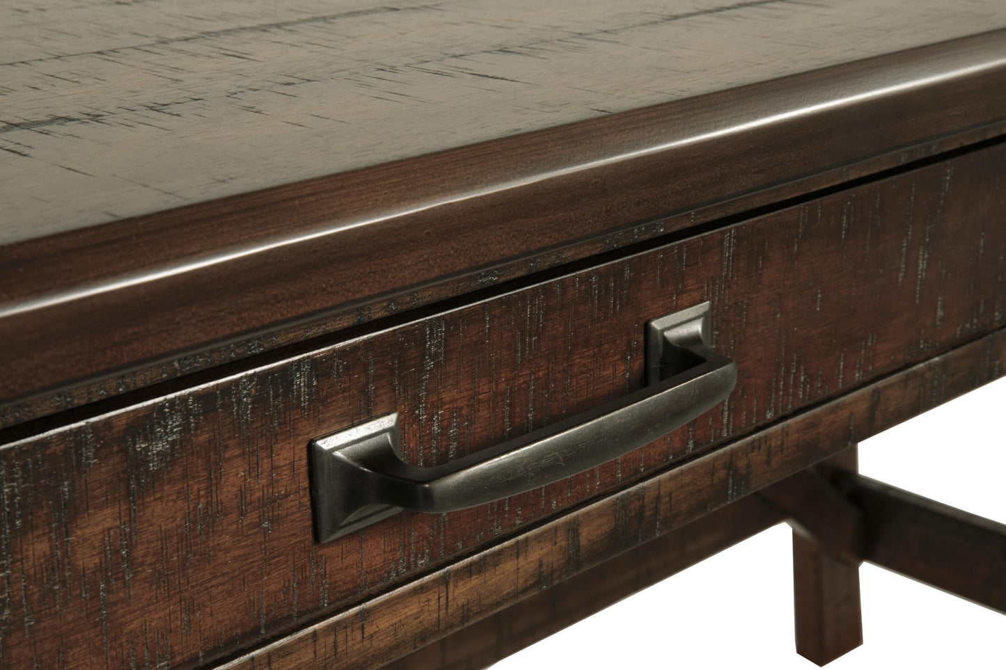 Close-up of the Baldridge Home Office Large Leg Desk featuring a metal drawer handle and textured, distressed finish—ideal for adding rustic character to your workspace.