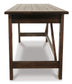 The Baldridge Home Office Large Leg Desk features a rectangular wooden design with a dark finish, visible legs, and support beams—ideal as a rustic industrial or stylish home office desk.