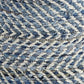 Close-up of the Chevron Pouf's woven fabric, showcasing its chevron pattern with alternating blue denim and beige fibers—ideal for adding texture and style to handmade furniture or accenting a square ottoman.