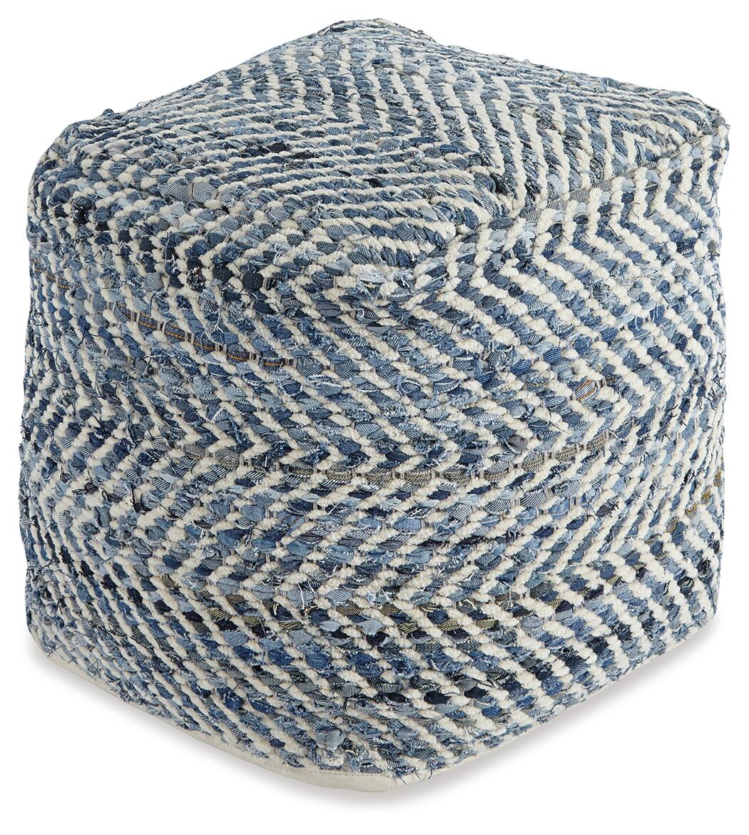 The Chevron Pouf is a square, handmade ottoman with a woven blue and white zigzag pattern that adds style to any space.