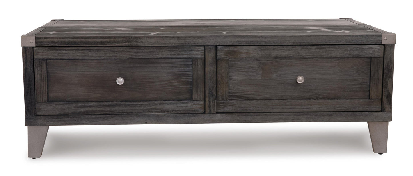 The Todoe Lift Top Cocktail Table is a rectangular, dark wood rustic-industrial table featuring two drawers with silver knobs and short angled legs.