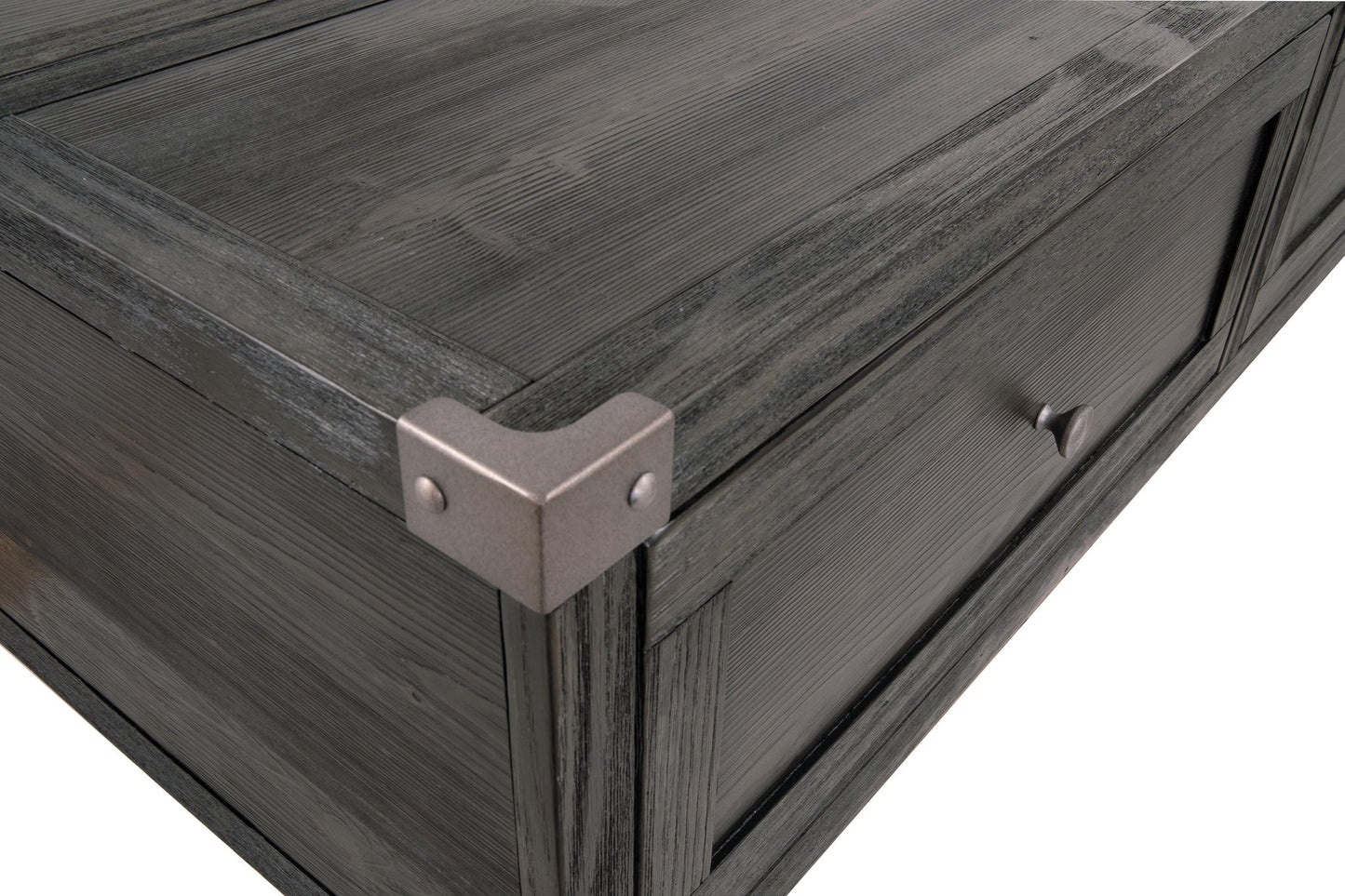 Close-up of the Todoe Lift Top Cocktail Table's dark wood drawer corner, featuring a metal corner protector and round handle in rustic-industrial style, isolated on a white background.