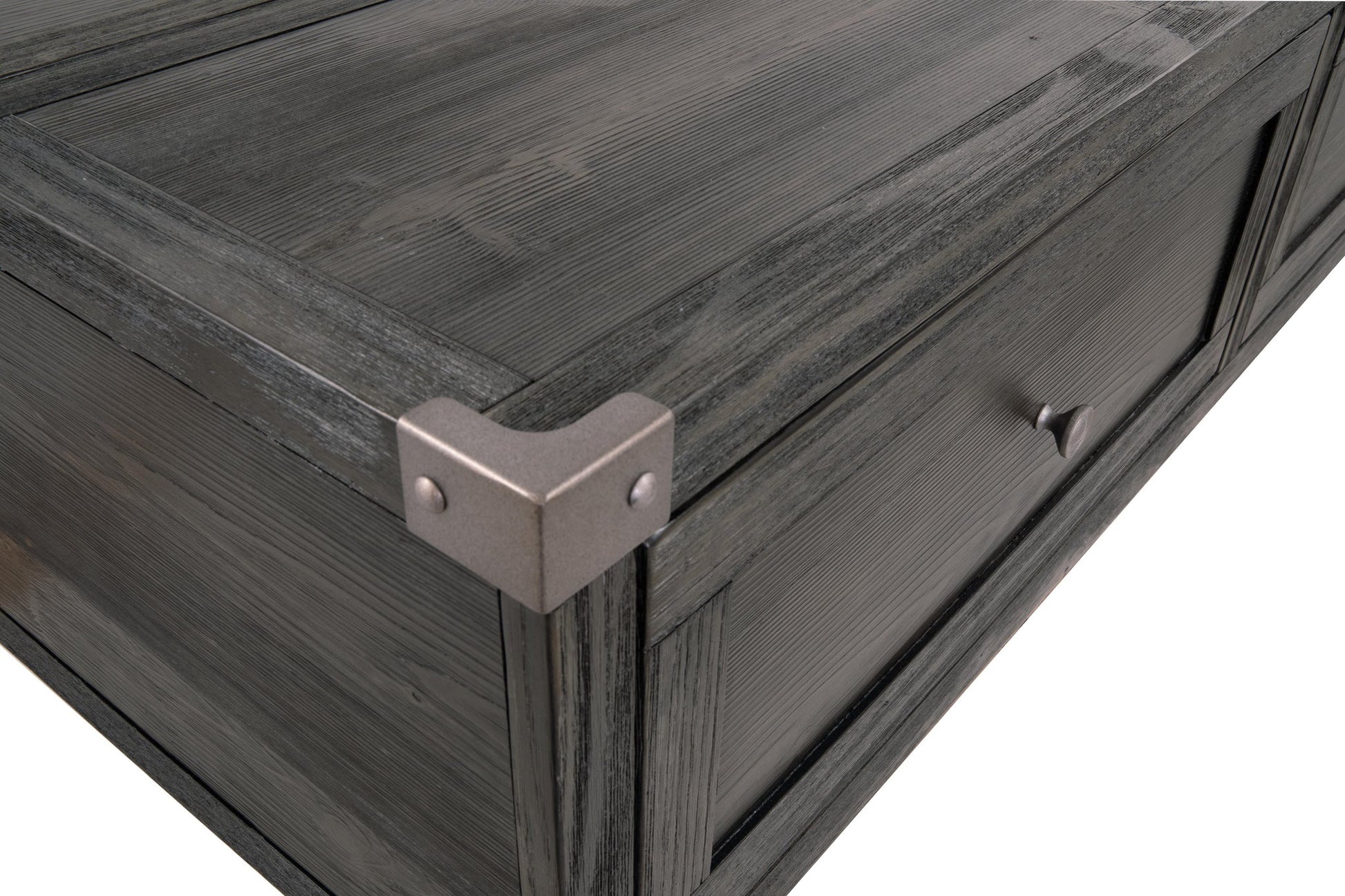 Close-up of the Todoe Lift Top Cocktail Table's dark wood drawer corner, featuring a metal corner protector and round handle in rustic-industrial style, isolated on a white background.