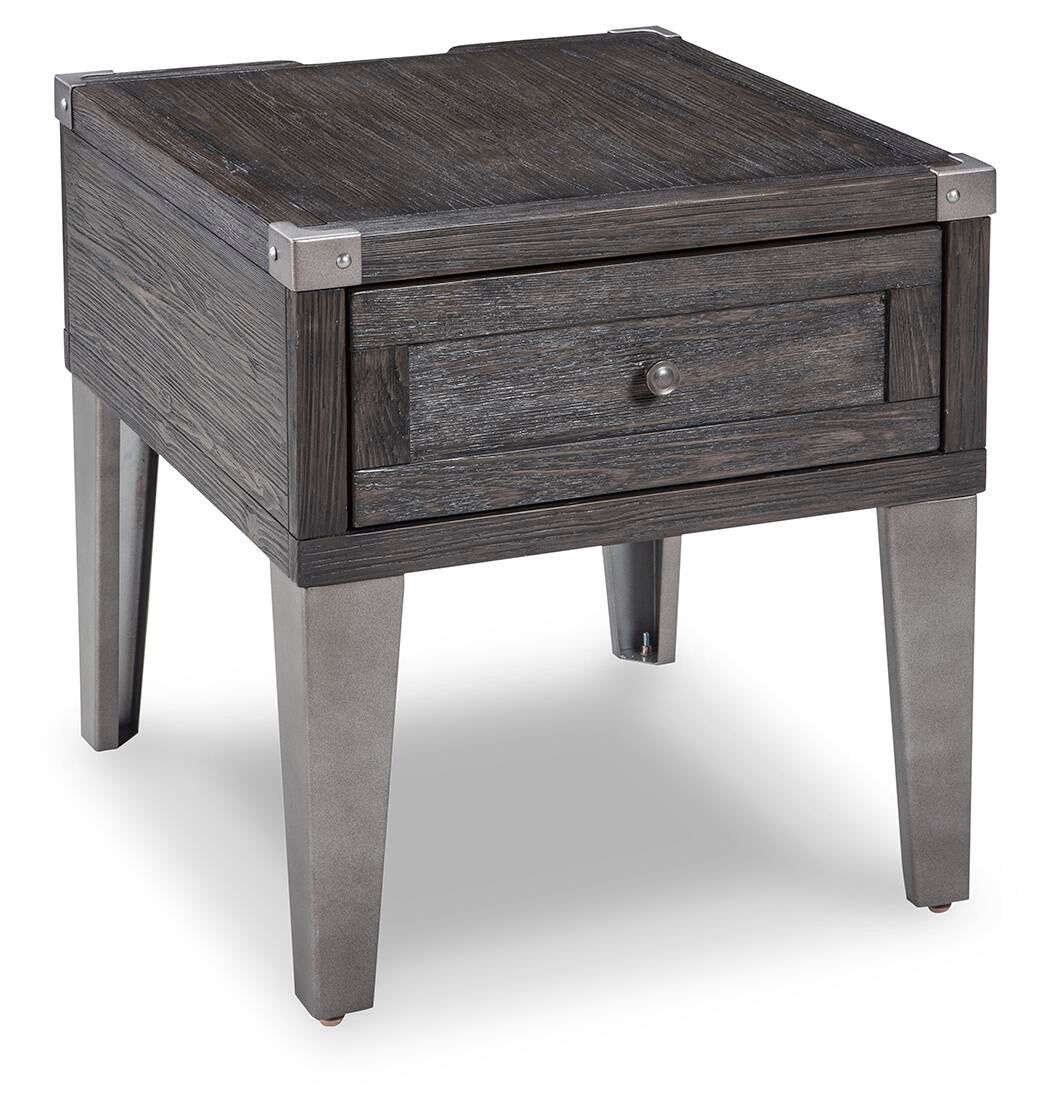 The Todoe Rectangular End Table blends rustic and industrial styles with a wooden top, metal legs and corner accents, plus a single drawer featuring a round knob.