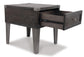 The Todoe Rectangular End Table is a contemporary dark wood side table with tapered legs, a single drawer with metal rails and a round pull handle, plus built-in USB charging ports for added convenience.