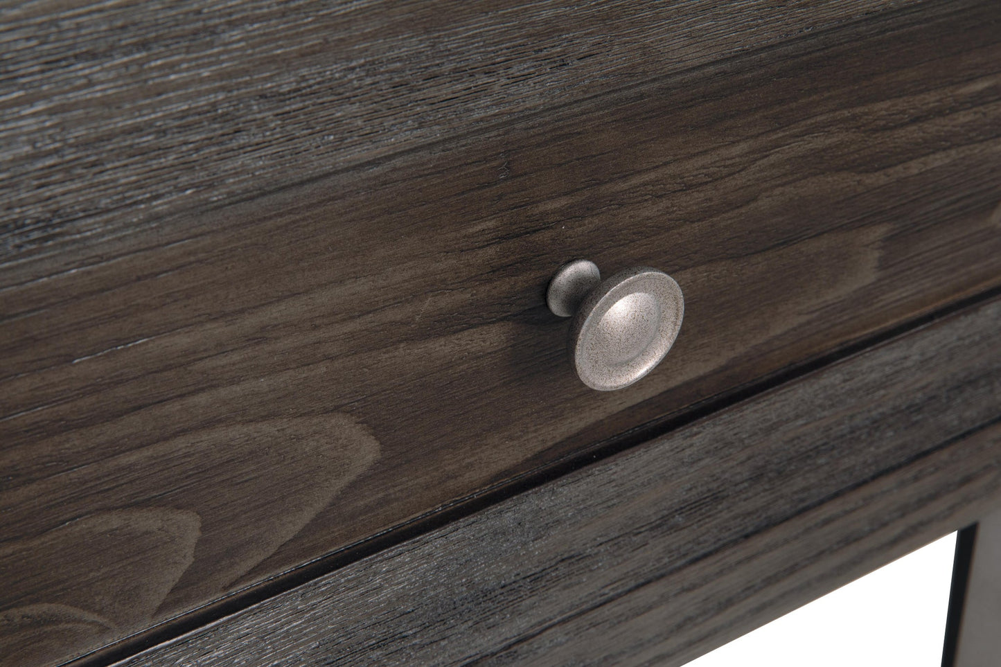 Close-up of a dark wood drawer with a metallic round knob handle, part of the Todoe Rectangular End Table—a rustic-industrial piece that blends modern design details.