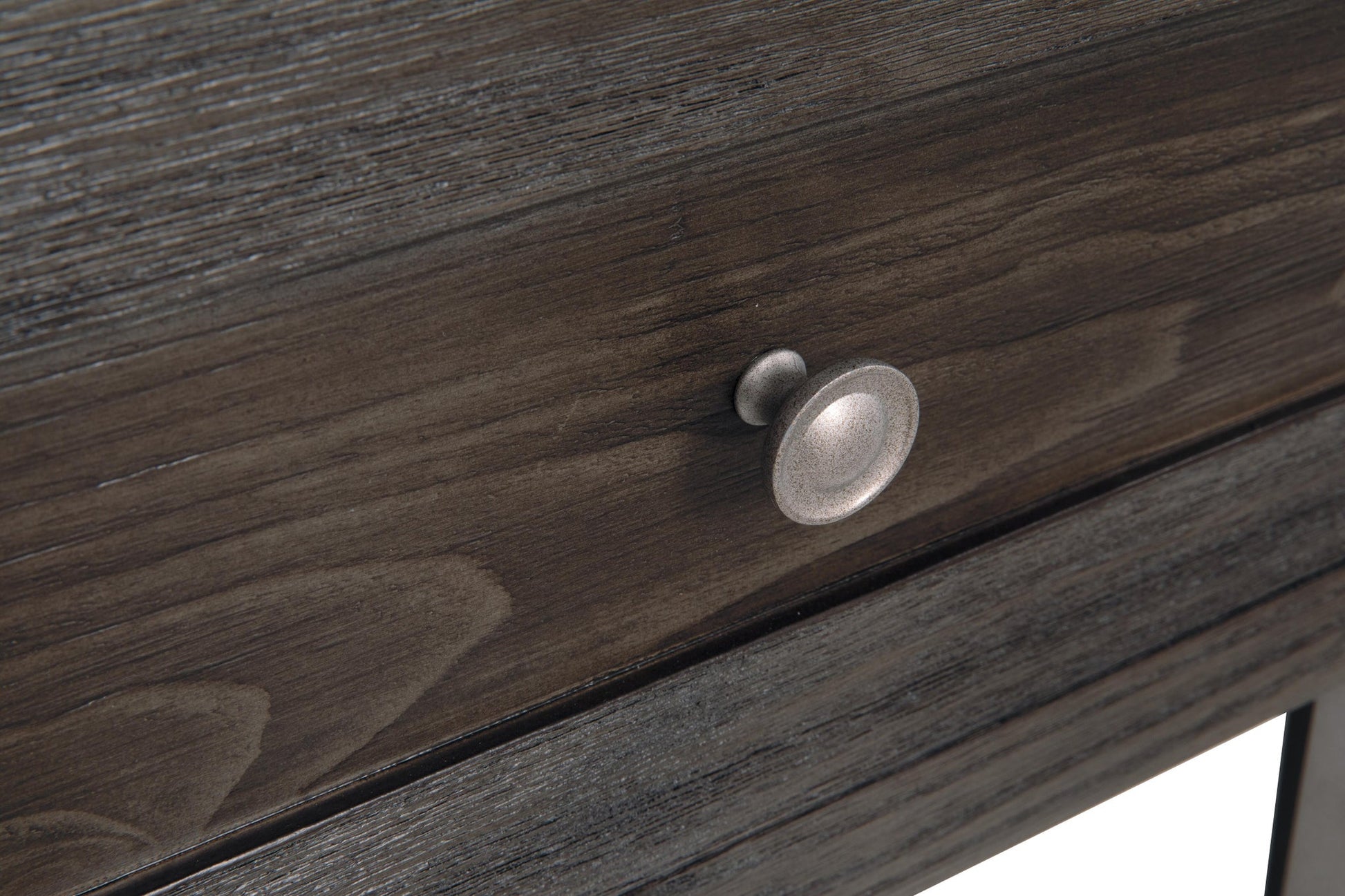 Close-up of a dark wood drawer with a metallic round knob handle, part of the Todoe Rectangular End Table—a rustic-industrial piece that blends modern design details.
