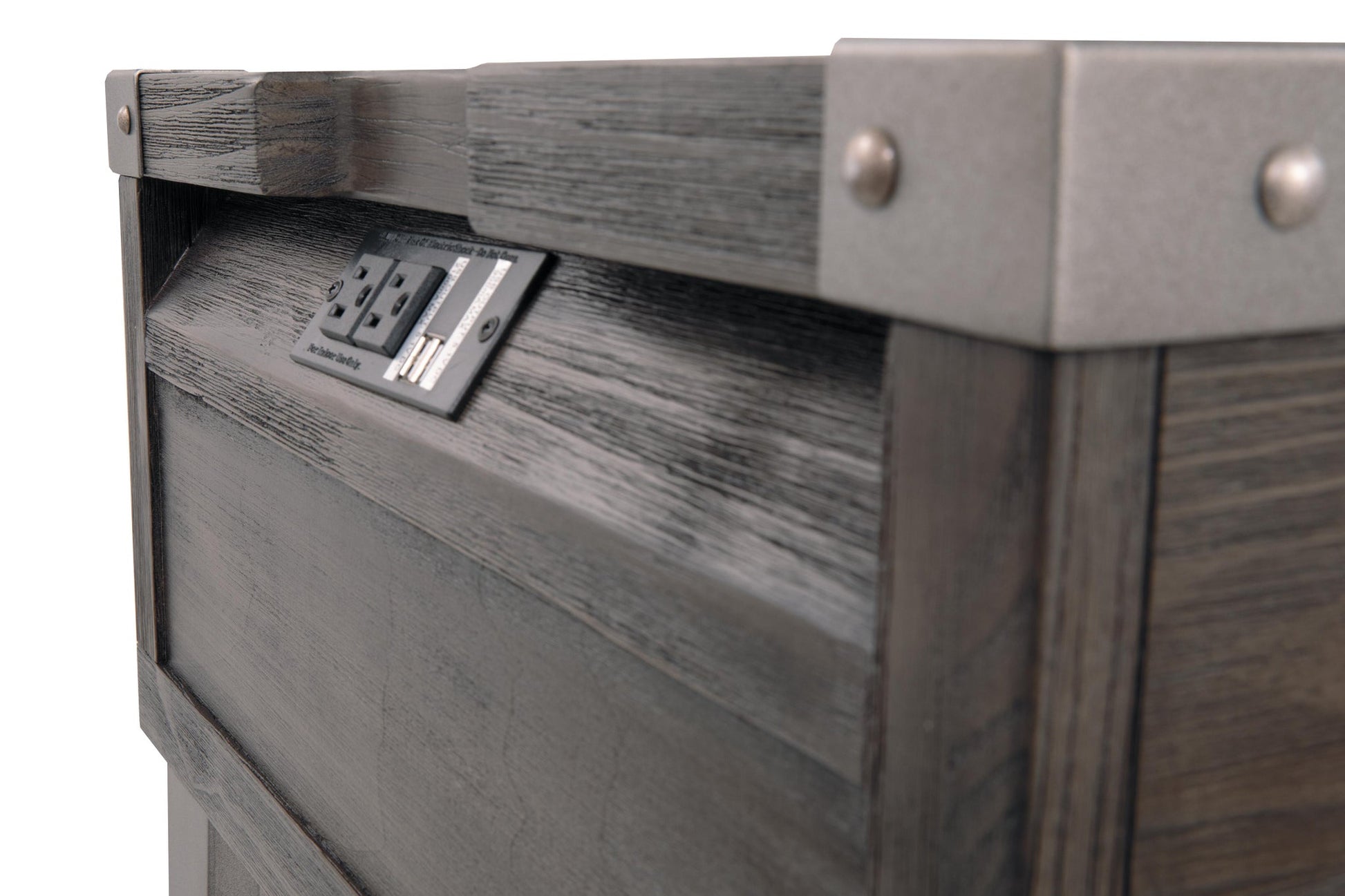 Close-up of the Todoe Rectangular End Table, a rustic-industrial piece with metal corner brackets and a built-in power outlet panel featuring two electrical sockets and USB charging ports.