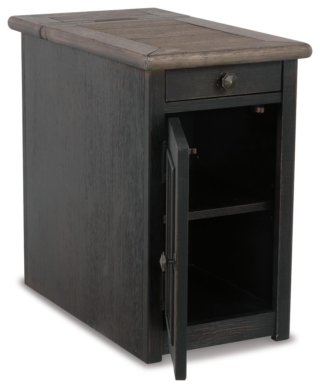 The Tyler Creek Chair Side End Table features a weathered gray-brown finish, dark wood accents, one top drawer, and a lower cabinet door that opens to an interior shelf for added storage.