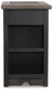 Front view of the Tyler Creek Chair Side End Table in weathered gray-brown with a dark finish, solid panel, two horizontal bars, and a built-in charging station for added convenience.