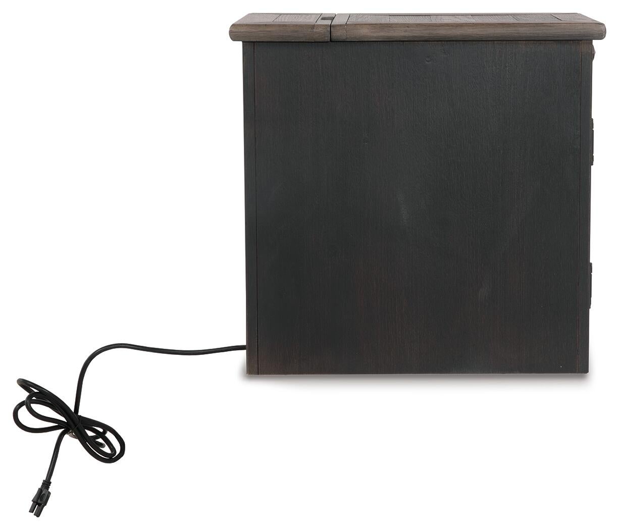 The Tyler Creek Chair Side End Table features a weathered gray-brown rectangular wood design with a closed lid and a black electrical cord extending from the side, serving as a stylish compact table with built-in charging capabilities.
