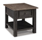 The Tyler Creek Rectangular End Table features a solid wood build, single drawer, lower shelf, and a weathered gray-brown top that contrasts elegantly with its dark-finished legs and base.
