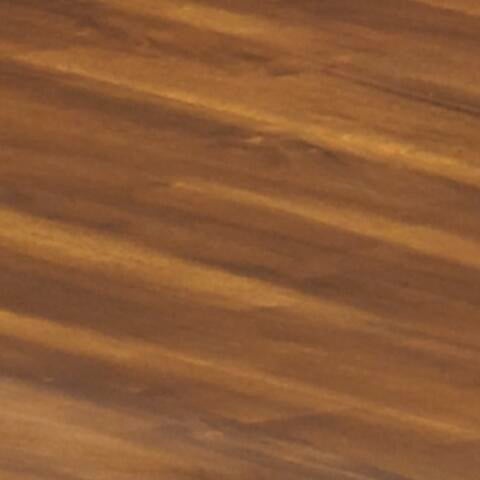 Close-up view of the Berringer Round DRM Drop Leaf Table’s wooden surface, highlighting its smooth finish and natural brown grain patterns.