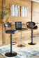 Three Bellatier Tall UPH Swivel Barstools with black and brown faux leather upholstery are arranged at a wooden bar counter in a room featuring wood-paneled walls, wall art, and a colorful rug.