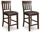 Two Haddigan Upholstered Barstools (set of 2) with slat backs and dark faux leather seats are displayed side by side against a white background.