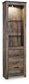 The Trinell Pier is a tall wooden entertainment center with a rustic finish, adjustable glass shelves above, two drawers below, metal handles, and a built-in top light.