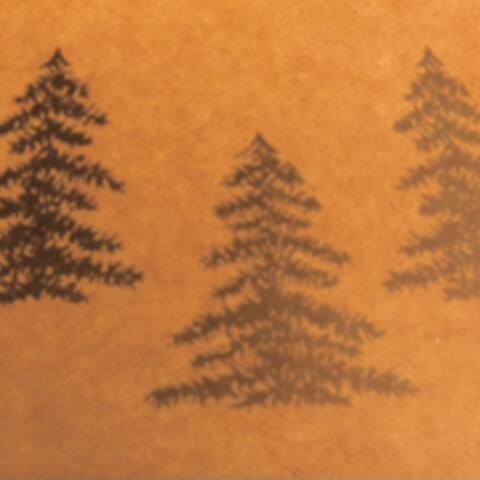 Three black pine tree silhouettes appear on a brown paper background, giving the Derek Poly Table Lamp (2/CN) a mountain retreat vibe that complements rustic decor with antler and pinecone accents.