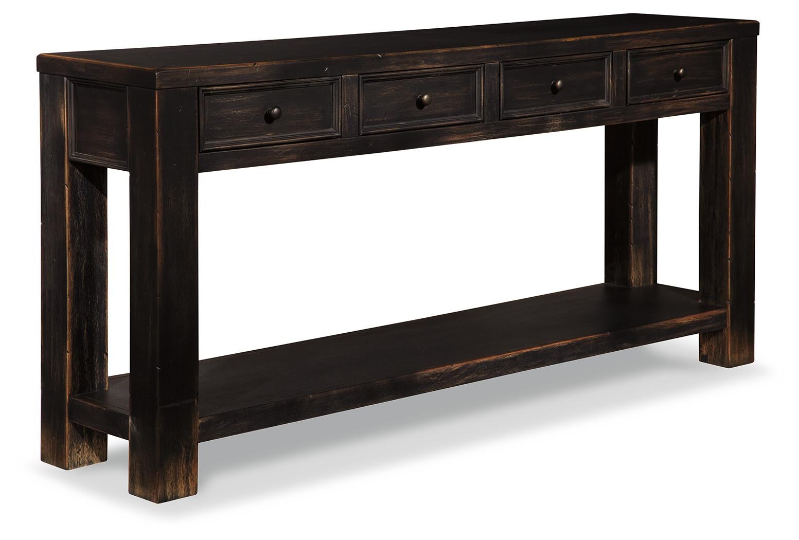 The Gavelston Sofa Table features a weathered black finish, dark wood construction, four drawers, and an open lower shelf for added primitive charm.