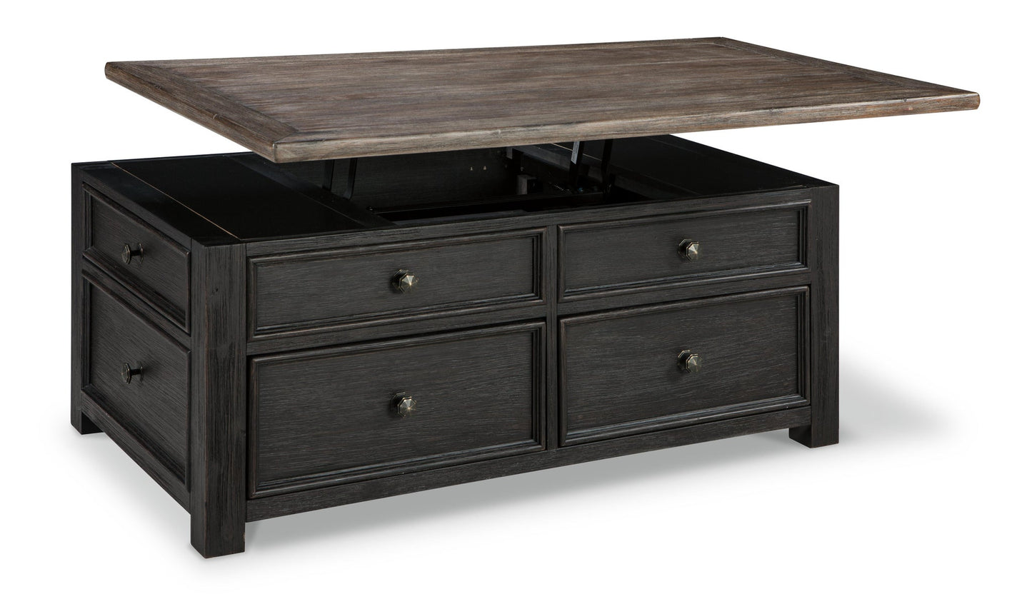 The Tyler Creek Lift Top Cocktail Table features a dark wood finish, four drawers, and a partially raised lift-top surface that reveals spacious internal storage.