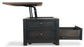 The Tyler Creek Lift Top Cocktail Table features a dark wood finish, a lift-top mechanism revealing interior storage, and a lower drawer that can be pulled out.