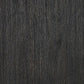 Close-up of a dark, textured wood surface with vertical grain patterns, perfect for the Tyler Creek Rectangular Dining Room Table in an urban farmhouse dining space.