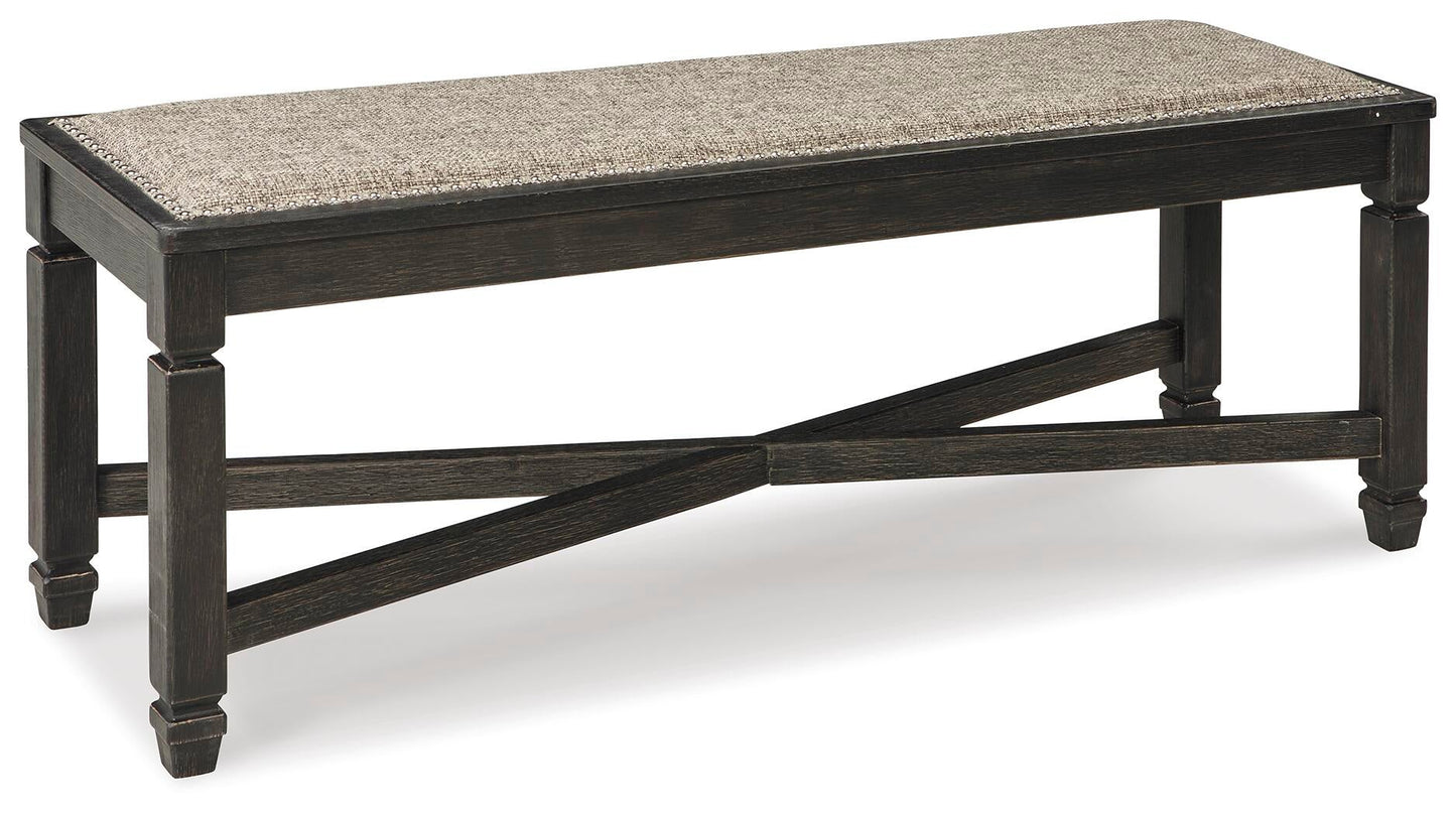 The Tyler Creek Upholstered Bench features a cushioned neutral fabric seat and sturdy black cross-braced legs, adding an urban farmhouse touch to your dining room.